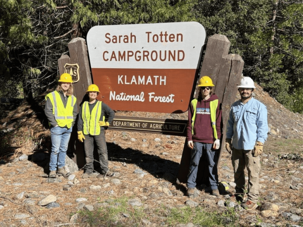 California Restoration Crew standing in front of Klamath National Forest sign