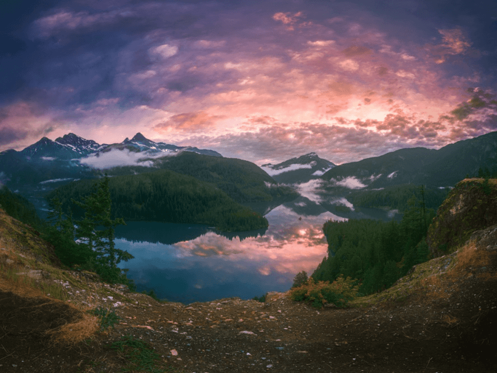 North Cascades stream and mountains under pink sky