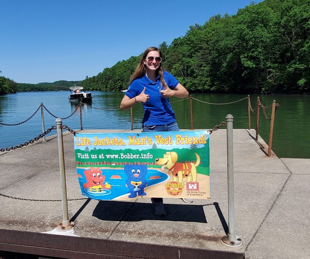 SCA Water Safety Intern posing with table at Raystown Lake
