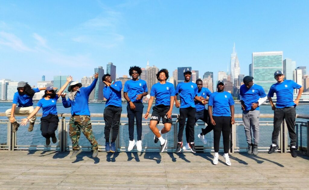 Urban Green New York City Members jumping in air celebrating