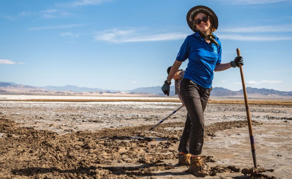 SCA Desert Restoration Corps Crew Member Pearl McCann holding rake 